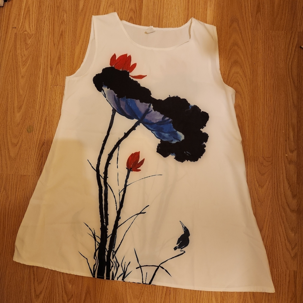 White sleeveless mini dress with a flower design on it, size xlarge